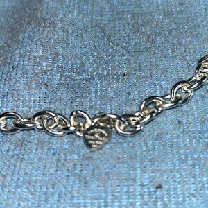 Tiffany & Co Charms Snoopy the Jazzman plus a mini with a diamond length is 7”.